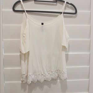 White blouse with lace detailing.